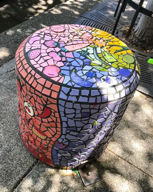Close-up of a rainbow color mosaic pedestal in Downtown Chico along the self-guided arts tour