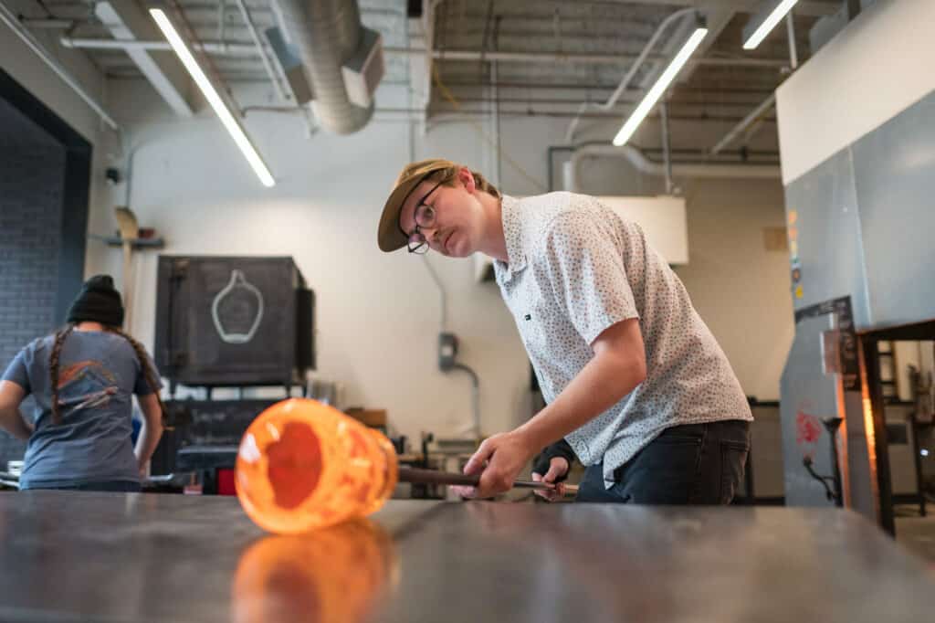 Students Working in the Glass Blowing Studio (Jason Halley/Chico State)