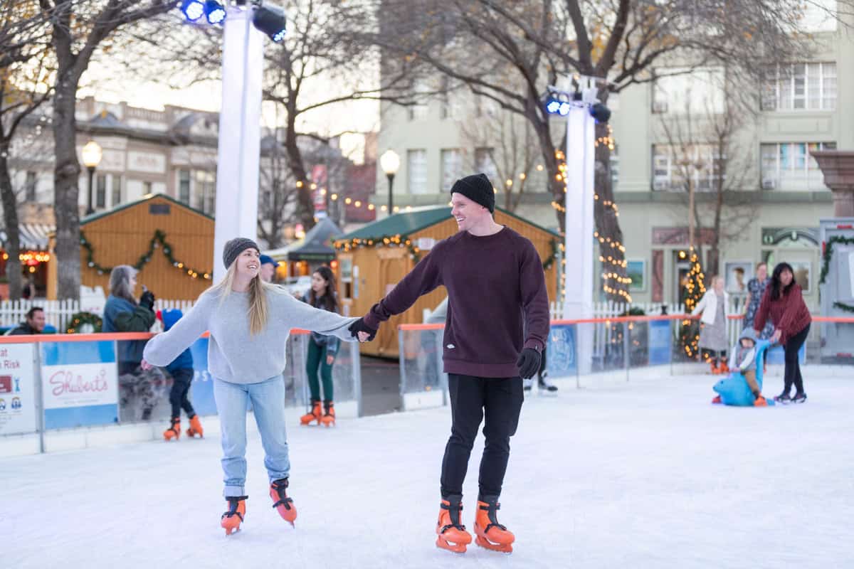 Chico Ice Rink in the Plaza 7 A couple ice skating hand-in-hand at the Chico Ice Rink in the Plaza during a visit to Chico in the winter
